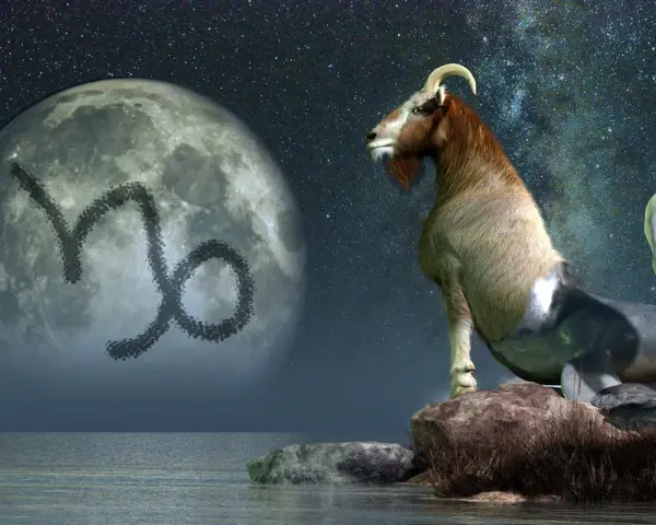 Mitologiczna koza z rybim ogonem, symbolizująca ascendent w koziorożcu, patrzy na księżyc z jego znakiem.
