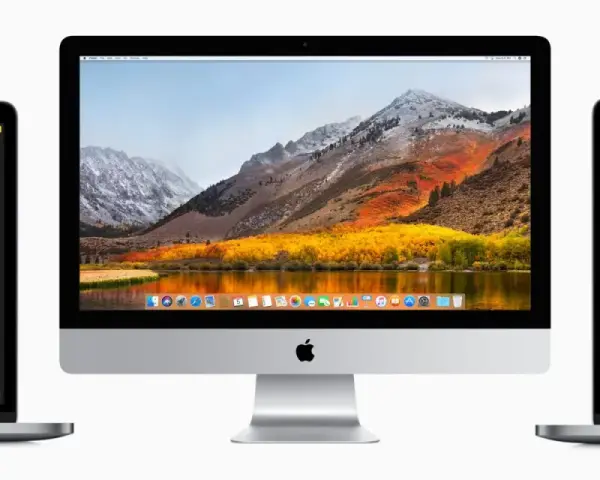Trzy urządzenia z systemami macOS: iMac z malowniczym krajobrazem na ekranie i dwa laptopy, jeden z edytorem zdjęć, drugi z aplikacją Poczta.
