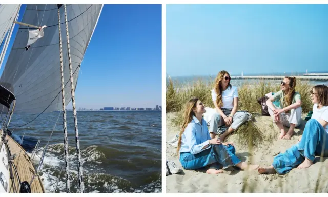 Un voilier prend le large, ses voiles gonflées par le vent. Sur la plage, des amies profitent du soleil, un moment de détente avant d'embarquer pour une nouvelle aventure.