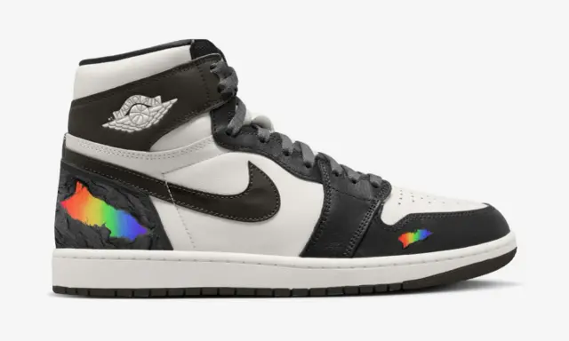 Der erste Air Jordan High mit Regenbogen-Akzenten, die wie ein Riss in der schwarzen Oberfläche wirken.