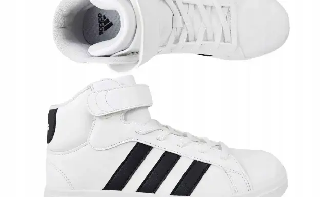 Białe buty sportowe Adidas z czarnymi paskami i rzepem. Idealne dla każdego, kto ceni wygodę i styl, jak wszystkie modele butów adidas.
