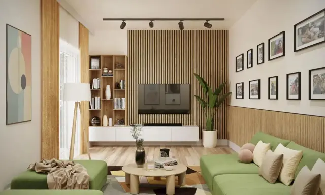 Nowoczesny salon z zieloną kanapą i stolikiem kawowym. Ściana za telewizorem ozdobiona jest pionowymi lamelami, które nadają wnętrzu ciepła i elegancji.