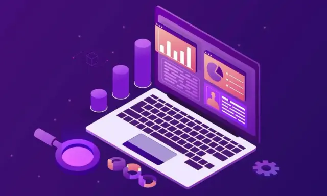 Laptop z wykresami i lupą, symbolizujące analizę danych w trendy ecommerce.