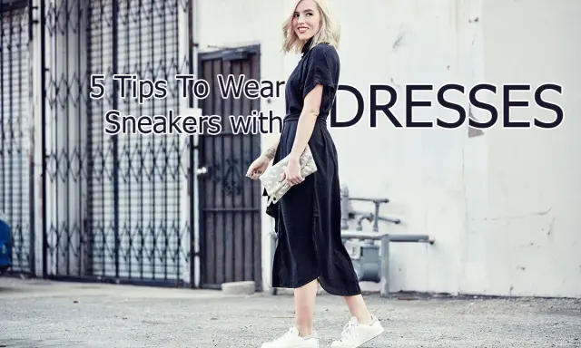 A woman shows how to wear sneakers with a dress, pairing white sneakers with a black midi dress and a clutch.