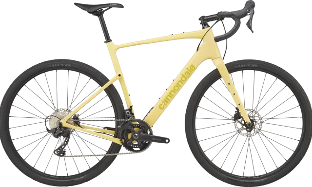 Żółty rower gravelowy Cannondale Topstone Carbon 3 z napędem Shimano GRX, gotowy na każdą przygodę.
