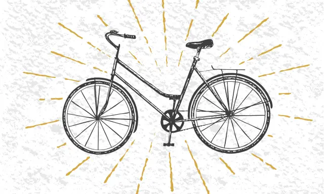 Czarno-biały szkic roweru, być może pierwszy rower na świecie, otoczony złotymi promieniami na teksturowanym tle.