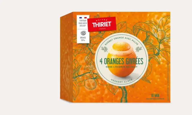 Boîte de sorbet "4 Oranges Givrées" de Maison Thiriet, avec une illustration d'orange garnie de sorbet dans son écorce.