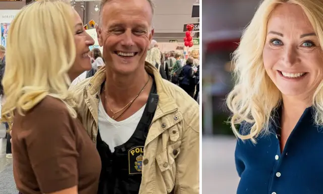 Martina Haag och hennes partner ler glatt. Han bär en väst med polisbricka.