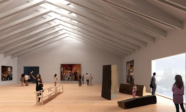 Besökare njuter av konst i en ljus konsthall i Tornedalen. Träskulpturer och målningar visas upp.
