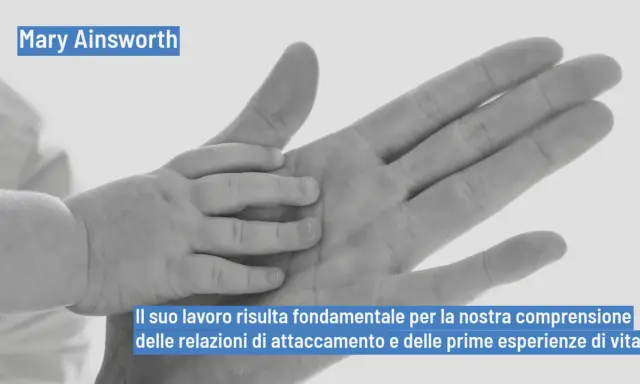 Mani di adulto e bambino si stringono, simbolo del lavoro di Mary Ainsworth sull'attaccamento e le prime esperienze di vita.
