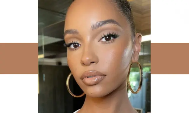 Un teint de peau lumineux et naturel, sublimé par un maquillage subtil et des boucles d'oreilles dorées.