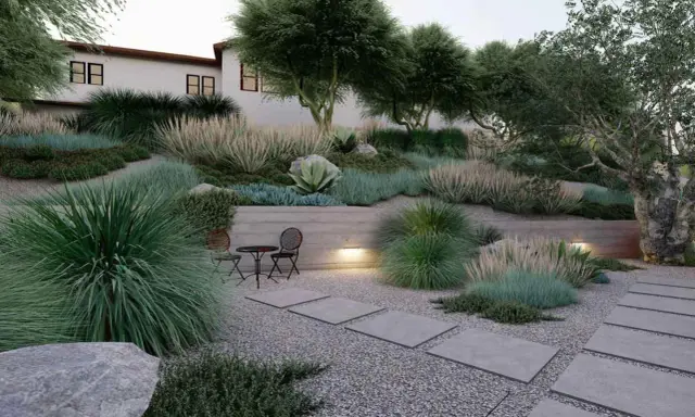 Un giardino moderno con ghiaia, piante succulente e graminacee. Idee originali per un giardino con ghiaia, con un piccolo tavolo e sedie per godersi la tranquillità.