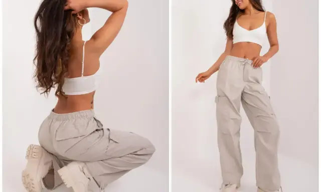 Modelka prezentuje luźne, beżowe spodnie cargo i biały top. Idealne pytanie: jakie buty do kulotów? Grube trapery świetnie uzupełniają ten look.