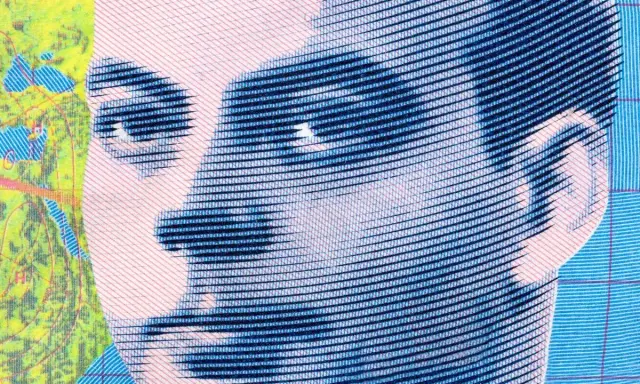 Portret stylizowany na mapę, przypominający Antoine de Saint-Exupéry'ego. Jego spojrzenie skłania do refleksji nad jego cytatami.