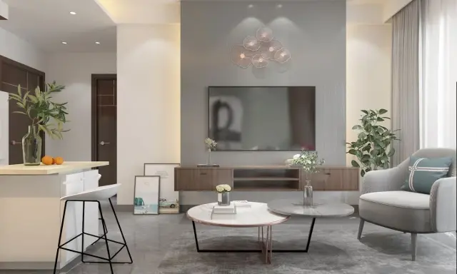 Soggiorno moderno con divano grigio, tavolini rotondi e decorazioni floreali. I colori da abbinare al grigio perla includono tocchi di verde e arancio.