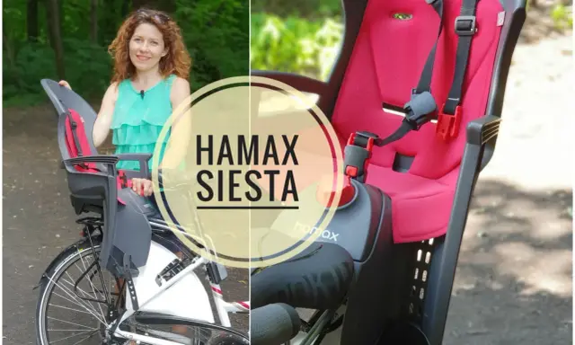 Kobieta prezentuje fotelik rowerowy Hamax Siesta, idealny do bezpiecznych podróży z dzieckiem.