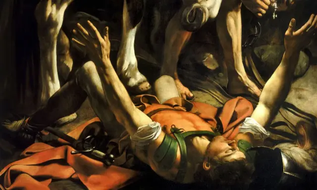 La conversion de saint Paul par Caravage : Paul, tombé de cheval, reçoit la lumière divine. Ses bras levés implorent, tandis que les jambes du cheval dominent la scène.