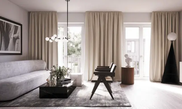 Ett modernt vardagsrum med en elegant soffa, mörkt marmorbord och en unik golvlampa. Blå inredning i vardagsrummet skapar en lugn atmosfär.