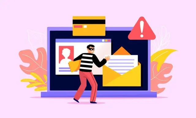 Złodziej kradnie dane z laptopa, przykład clickbaitu. Karta kredytowa i ostrzeżenie.