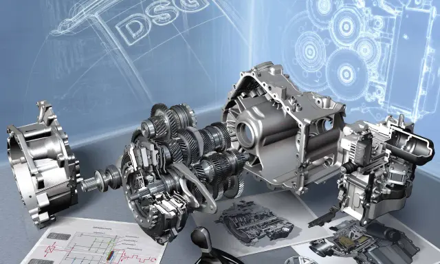 Rozłożony na części mechanizm DSG, z widocznymi trybami i schematami technicznymi.