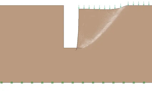 Simulación de estabilidad de talud, mostrando la falla de una zanja bajo carga.