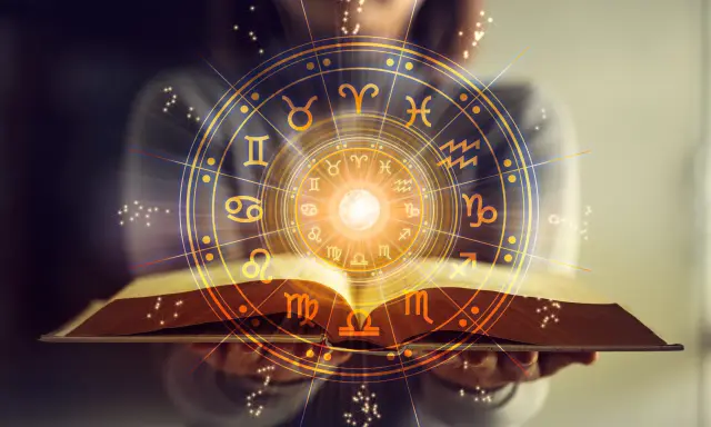 Otwarta księga z kręgiem znaków zodiaku. Horoskop Bliźnięta zdrowie – odkryj swój potencjał.