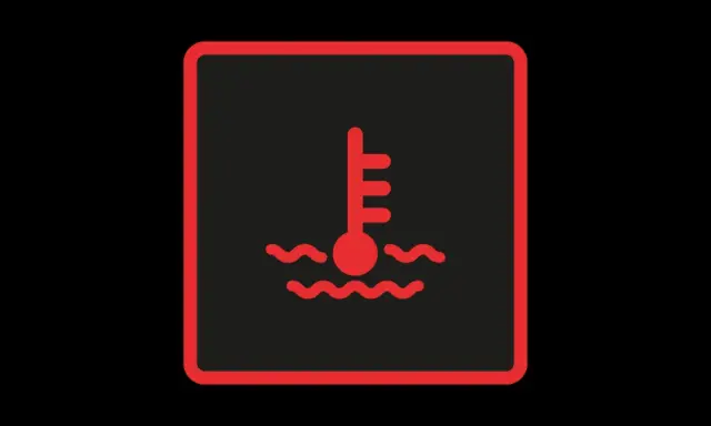 Voyant rouge indiquant une surchauffe moteur au démarrage. Thermomètre dans l'eau bouillante.