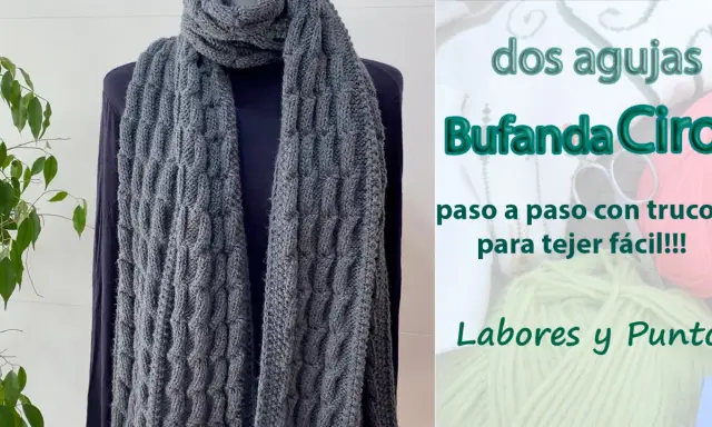 Bufanda punto gris con textura de trenzas, ideal para aprender a tejer fácil.