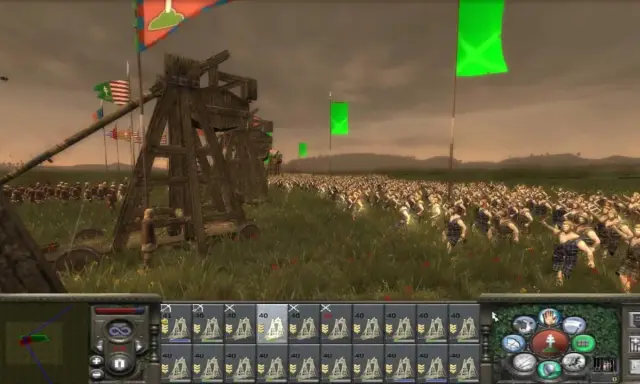 Bitwa w grze strategicznej, przypominającej gry podobne do Total War. Ogromna armia w starożytnych strojach, machiny oblężnicze i flagi na tle pochmurnego nieba.