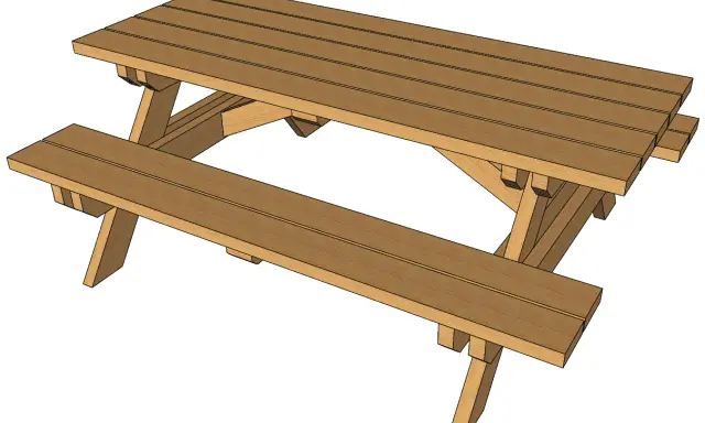 Table en bois extérieur fait maison, parfaite pour les repas en famille ou entre amis.