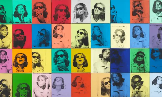Andy Warhol pop art painting featuring a woman in sunglasses repeated in a grid of vibrant, contrasting colors.