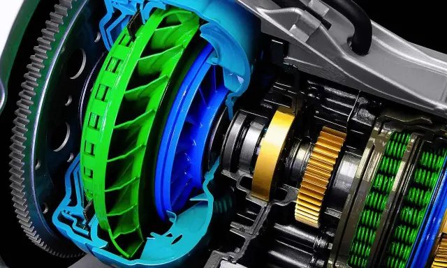Corte detallado de una **caja de cambios automática** con turbina verde y azul, engranajes dorados y resortes verdes.