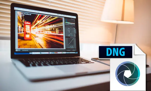 Edición de archivos DNG en un portátil, mostrando una foto nocturna con luces de neón y un icono de cámara.