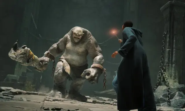 Student walczy z trollem w mrocznym lochu. Czy to przygoda z Hogwarts Legacy Game Pass?