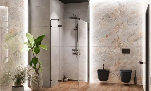Nowoczesna łazienka z prysznicem walk-in. Deszczownica zamontowana na odpowiedniej wysokości, obok czarna miska WC i bidet.