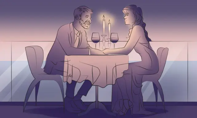 Romantyczna kolacja przy świecach. Para trzyma się za ręce, celebrując rocznicę ślubu na wesoło.