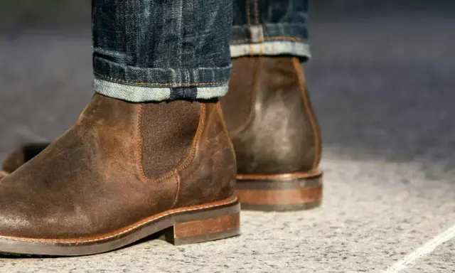 These rugged brown leather chelsea boots, paired with cuffed denim, prove that chelsea boots are in style and perfect for a casual yet sharp look.