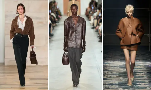 Modelli sfilano con outfit in colore testa di moro, mostrando abbinamenti eleganti con pantaloni neri, grigi e completi in pelle.