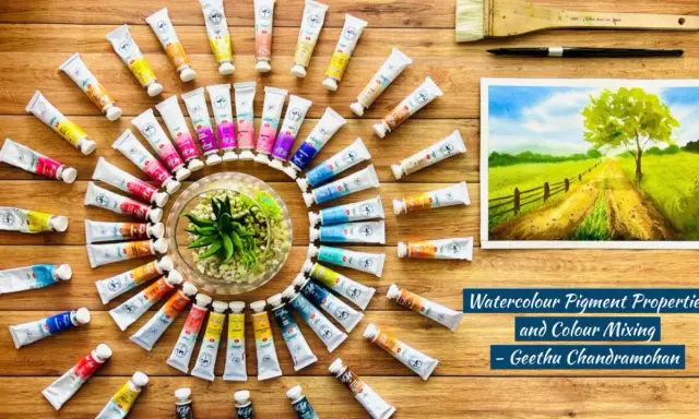 Des tubes de peinture à l'aquarelle, un pinceau et une œuvre d'art. Comprendre la différence entre pigment et colorant est essentiel pour des créations vibrantes.