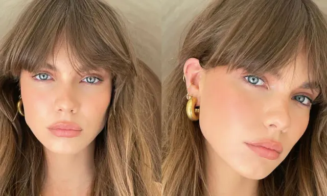 Mujer con ojos azules y cabello castaño, luciendo un "no makeup makeup look" con mejillas sonrosadas y labios naturales.