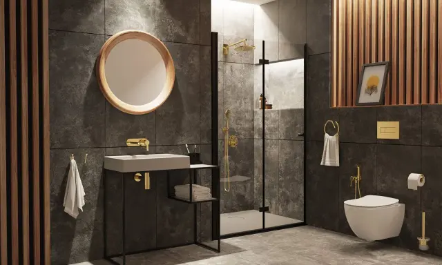Nowoczesna łazienka z prysznicem, umywalką i podwieszaną miską WC. Złote baterie i dodatki dodają elegancji. Bidetta na jakiej wysokości? Jest zamontowana obok miski WC.