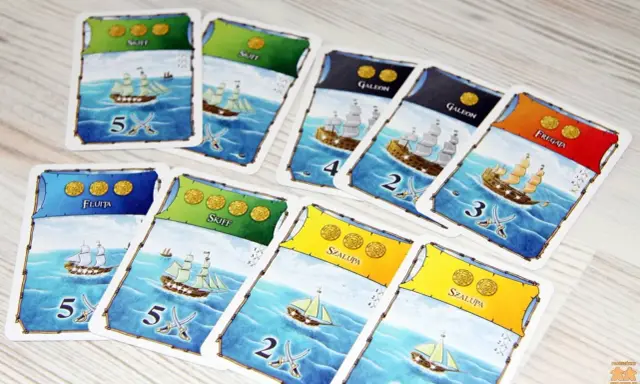 Karty do gry "Port Royale" przedstawiające statki: fluitę, skiff, galeon, szalupę i fregatę, gotowe do morskiej przygody.