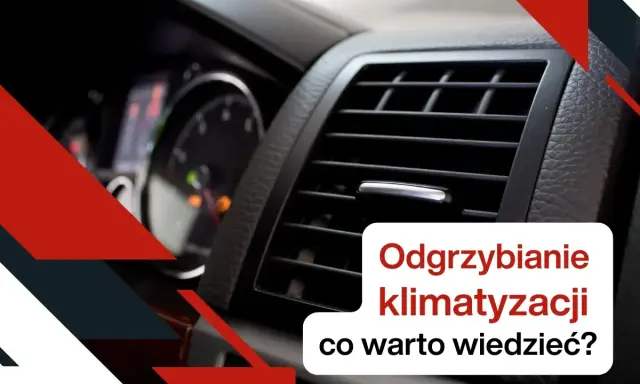 Widok na kratkę nawiewu klimatyzacji samochodowej i deskę rozdzielczą.