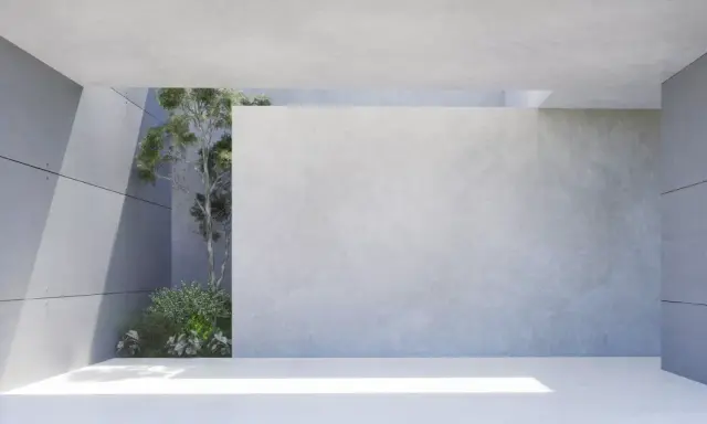 Moderne Architektur mit transluzentem Beton und grüner Vegetation. Sonnenlicht fällt durch eine Öffnung und beleuchtet den Boden.