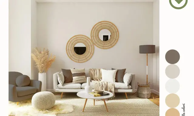 Soggiorno accogliente con divano, poltrona e pouf. Specchi rotondi in rattan e una palette colori neutri arredamento creano un'atmosfera rilassante.