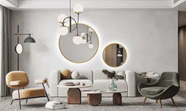 Nowoczesny salon z dwoma okrągłymi lustrami, które stanowią centralny punkt dekoracyjny.