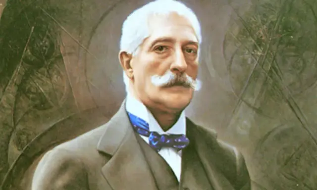 Ritratto di uomo anziano con baffi bianchi, abito scuro e papillon blu. Potrebbe essere un personaggio chiave nel nedda verga riassunto.