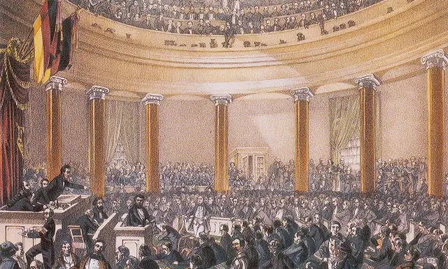 Versammlung im Paulskirchen-Saal, ein wichtiger Moment im zeitstrahl revolution 1848. Männer in Anzügen diskutieren lebhaft.