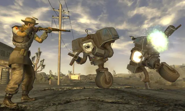 Postapokaliptyczny pustynny krajobraz, gdzie gracz w stylu gry podobnej do Fallout walczy z robotami.