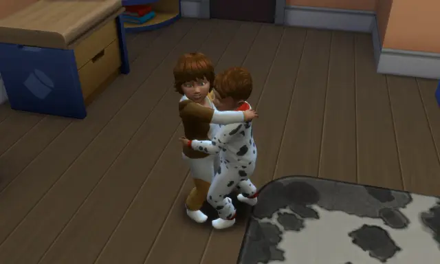 Dzieci w piżamkach przytulają się. W The Sims 4, aby zrobić dziecko, potrzebujesz dorosłych Simów i łóżka.